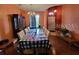 Traditional dining room with large table, cabinet, and elegant chandelier at 1107 Dartford Dr, Kissimmee, FL 34758