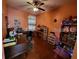 Home office with natural light, hardwood floors, and desk at 1107 Dartford Dr, Kissimmee, FL 34758
