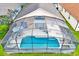 Aerial view showcasing the enclosed pool and outdoor living space at 1113 Casterton Cir, Davenport, FL 33897