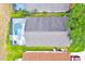 Aerial view of home with screen enclosed pool at 1113 Casterton Cir, Davenport, FL 33897