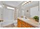 Cozy bathroom with tub and vanity, decorated with plant for fresh look at 1113 Casterton Cir, Davenport, FL 33897
