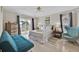 Bright bedroom with sliding glass doors, ceiling fan, and coastal-themed decor at 1113 Casterton Cir, Davenport, FL 33897