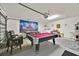 Large game room featuring a pool table, a secondary billiards table, laundry equipment, and ample space for recreation at 1113 Casterton Cir, Davenport, FL 33897