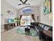 Open living area with a view of the pool, featuring a leather sectional at 1113 Casterton Cir, Davenport, FL 33897