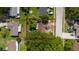 Aerial view of the property showcasing the home's placement, landscaping, and surrounding neighborhood at 1209 Marygon St, Kissimmee, FL 34744
