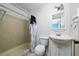 Cozy bathroom with shower and tub combination, and a vanity with storage at 1209 Marygon St, Kissimmee, FL 34744