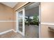 Access to covered patio with outdoor tile and access to fenced yard at 1209 Marygon St, Kissimmee, FL 34744