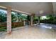 Outdoor patio area with ceiling fan and view to the private yard and fencing at 1209 Marygon St, Kissimmee, FL 34744