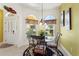 Bright breakfast nook featuring arched windows, decorative curtains, and comfortable seating at 1258 Donalds Pl, The Villages, FL 32162
