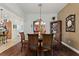 Bright dining room with wood floors and plenty of space for entertaining guests at 1258 Donalds Pl, The Villages, FL 32162