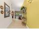 Welcoming entryway showcases tile flooring, a decorative mirror, and a glimpse into the living area at 1258 Donalds Pl, The Villages, FL 32162