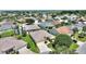 Inviting single-story home featuring a well-manicured lawn and mature landscaping at 1258 Donalds Pl, The Villages, FL 32162