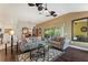 The living room features wood floors, ceiling fans and plenty of natural light at 1258 Donalds Pl, The Villages, FL 32162