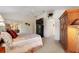 The main bedroom features carpet, a ceiling fan, and plenty of storage at 1258 Donalds Pl, The Villages, FL 32162