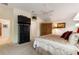 Carpeted main bedroom with ceiling fan and plenty of closet space at 1258 Donalds Pl, The Villages, FL 32162
