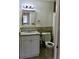 Bathroom featuring a white vanity, granite countertop, and a framed mirror at 1309 N Thacker Ave, Kissimmee, FL 34741