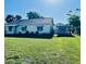A charming single-story house with a spacious front yard, perfect for outdoor activities and curb appeal at 1309 N Thacker Ave, Kissimmee, FL 34741