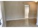 Open living area with sleek tile flooring and neutral-colored walls, providing a blank canvas for personal design at 1309 N Thacker Ave, Kissimmee, FL 34741