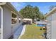 Spacious backyard featuring an above-ground pool, storage shed, and grassy area at 1408 Polk City Rd, Haines City, FL 33844