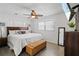 Bright and airy main bedroom with a king-size bed, hardwood floors, and large windows at 1408 Polk City Rd, Haines City, FL 33844