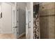 Bathroom shower with patterned curtain and tiled surround at 152 Whirlaway Dr, Davenport, FL 33837