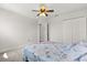 This bedroom features an open doorway and a sizable closet with bi-fold doors at 152 Whirlaway Dr, Davenport, FL 33837