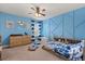 Bright blue bedroom featuring stylish decor and ample space at 152 Whirlaway Dr, Davenport, FL 33837