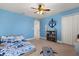 Comfortable bedroom featuring an anchor accent and a ceiling fan at 152 Whirlaway Dr, Davenport, FL 33837