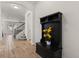 Hallway with tile flooring and an archway leading to the living room and stairs to the upper level at 152 Whirlaway Dr, Davenport, FL 33837
