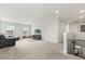 Spacious upstairs living room boasts two windows and access to the staircase at 152 Whirlaway Dr, Davenport, FL 33837