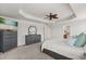 Cozy main bedroom with ceiling fan, dresser, and carpet flooring at 152 Whirlaway Dr, Davenport, FL 33837