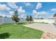 The backyard is fully fenced and landscaped and contains a concrete patio at 1602 Steely Dr, Dundee, FL 33838