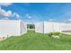 Well maintained yard featuring white fence and lush lawn at 1602 Steely Dr, Dundee, FL 33838
