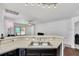 Modern kitchen featuring granite countertops, stainless steel appliances, and dark wood cabinetry at 1602 Steely Dr, Dundee, FL 33838