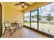 Enclosed patio featuring tile flooring and seating area at 1602 Steely Dr, Dundee, FL 33838
