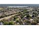 Breathtaking aerial view of a neighborhood surrounded by lush greenery and a serene lake at 1784 Sparkling Water Cir, Ocoee, FL 34761