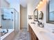 Bathroom with double sinks, a large mirror, and a separate shower and bathtub at 1784 Sparkling Water Cir, Ocoee, FL 34761