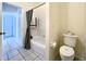 Bathroom with a white toilet and white tub at 1784 Sparkling Water Cir, Ocoee, FL 34761