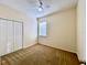 Simple bedroom with a ceiling fan, closet, and large window providing natural light at 1784 Sparkling Water Cir, Ocoee, FL 34761