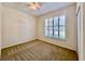 Bright bedroom with neutral carpet, plantation shutters, and a ceiling fan at 1784 Sparkling Water Cir, Ocoee, FL 34761