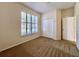 Comfortable bedroom with carpet flooring, a closet, and plantation shutters on the window at 1784 Sparkling Water Cir, Ocoee, FL 34761
