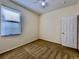 Neutral bedroom with a ceiling fan, carpeted floor, window and door at 1784 Sparkling Water Cir, Ocoee, FL 34761