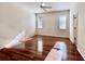 Well-lit bedroom with hardwood floors and two windows, creating a warm and inviting space at 1784 Sparkling Water Cir, Ocoee, FL 34761