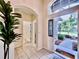 Open entryway with tiled floor, high ceilings, and a view to the outside at 1784 Sparkling Water Cir, Ocoee, FL 34761