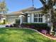 Exterior of a well-maintained one-story home with a manicured lawn and tasteful landscaping at 1784 Sparkling Water Cir, Ocoee, FL 34761