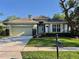 Charming one-story home with a well-manicured lawn, beautiful landscaping and a two-car garage at 1784 Sparkling Water Cir, Ocoee, FL 34761