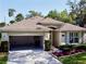 Charming home with a spacious driveway, manicured landscaping, and inviting curb appeal at 1784 Sparkling Water Cir, Ocoee, FL 34761