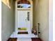 Inviting front door with decorative window above and a welcome mat and garden gnomes at 1784 Sparkling Water Cir, Ocoee, FL 34761