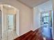 Hallway with wood floors and arched doorways at 1784 Sparkling Water Cir, Ocoee, FL 34761