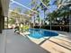 Beautifully screened pool with vibrant landscaping, creating a private oasis for relaxation and enjoyment at 1784 Sparkling Water Cir, Ocoee, FL 34761